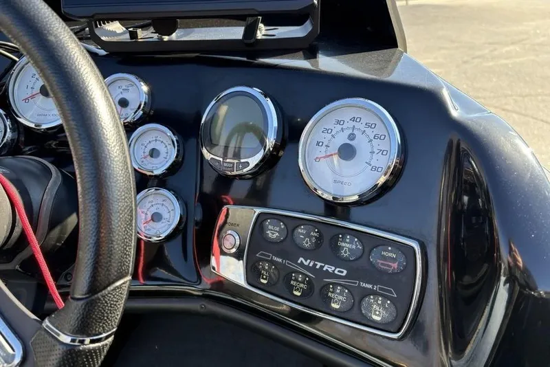Slide: The Image of Dashboard of a 2019 Nitro ZV19 boat with gauges and controls. - 29