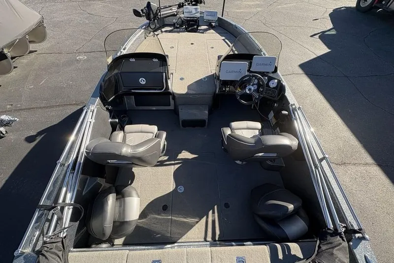 Slide: The Image of 2019 Nitro ZV19 boat interior with Garmin navigation, four seats, and spacious deck. - 30