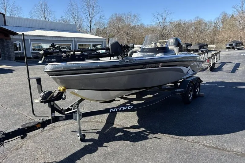 Slide: The Image of 2019 Nitro ZV19 boat on trailer in parking lot, featuring Garmin equipment. - 5