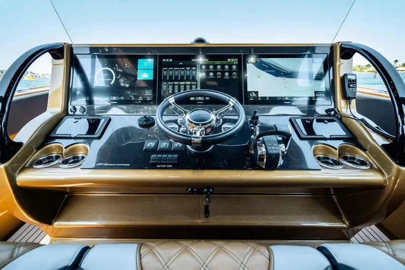 Slide: The Image of Cockpit of 2023 Midnight Express 43 Open yacht with advanced navigation displays and controls. - 7