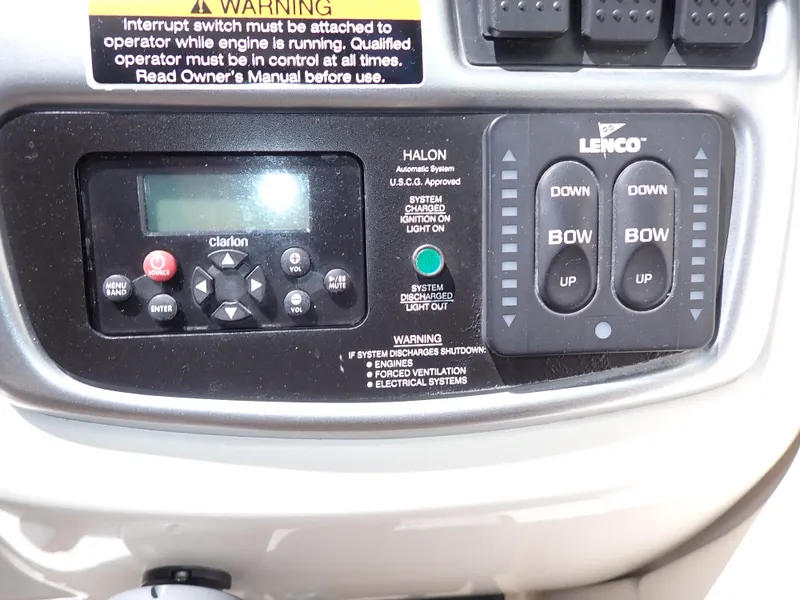 Slide: The Image of Control panel of a 2011 Chaparral 287 SSX boat with Clarion and Lenco systems. - 16