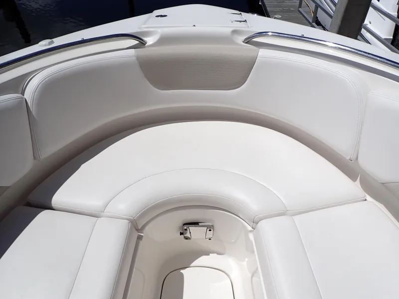 Slide: The Image of 2011 Chaparral 287 SSX boat interior with white cushioned seating. - 29