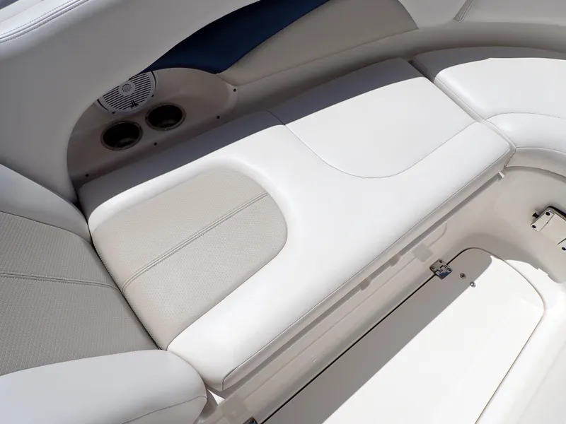 Slide: The Image of Luxurious seating on 2011 Chaparral 287 SSX boat, featuring sleek white upholstery. - 31