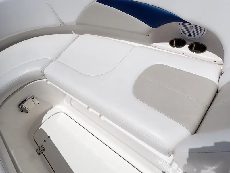 Slide: The Image of 2011 Chaparral 287 SSX boat interior with white seating and cup holders. - 33