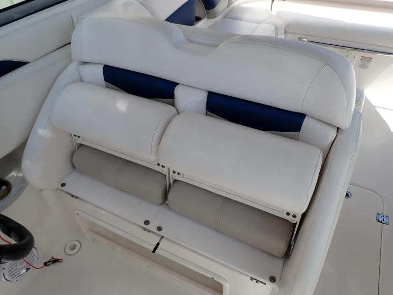 Slide: The Image of 2011 Chaparral 287 SSX boat interior with white and blue cushioned seating. - 38