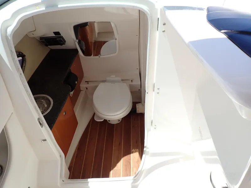 Slide: The Image of Chaparral 287 SSX 2011 boat bathroom with wood flooring and compact design. - 45