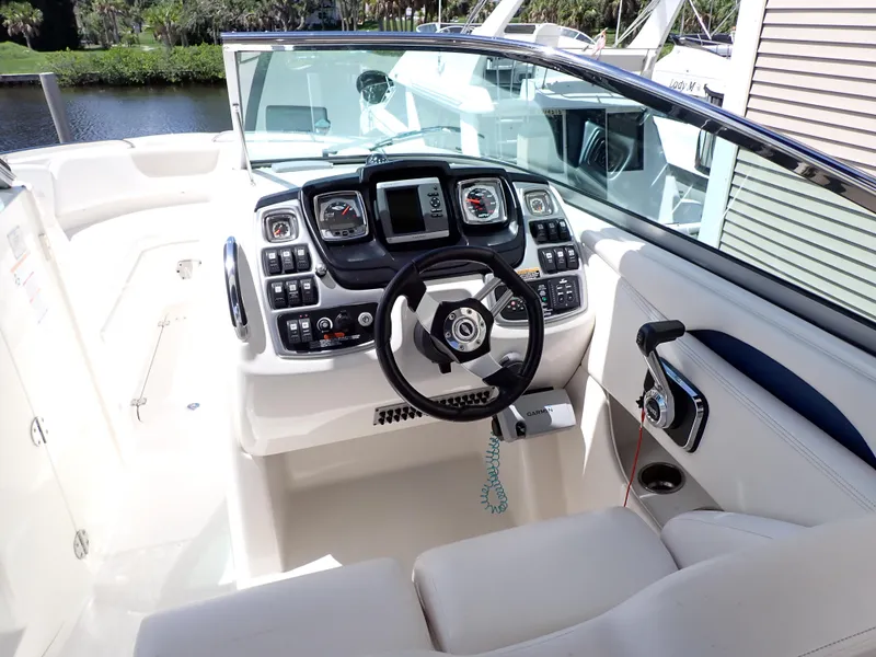 Slide: The Image of 2011 Chaparral 287 SSX boat cockpit with modern controls and steering wheel. - 5