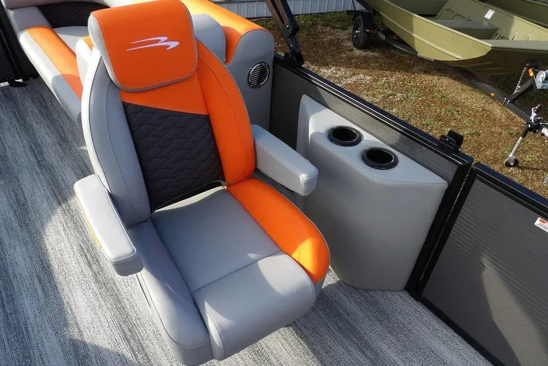 Slide: The Image of 2026 Bennington 22 SSR boat interior with orange and gray seating, cup holders. - 13