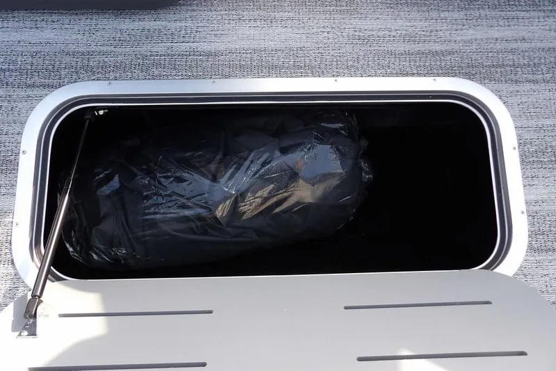 Slide: The Image of Storage compartment of 2026 Bennington 22 SSR boat, featuring spacious interior. - 16