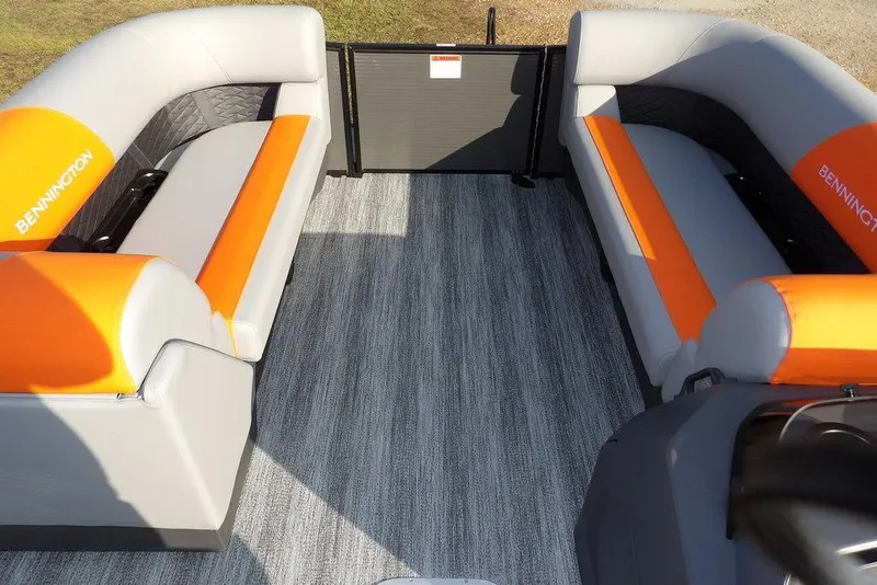 Slide: The Image of 2026 Bennington 22 SSR boat interior with orange and gray seating. - 19