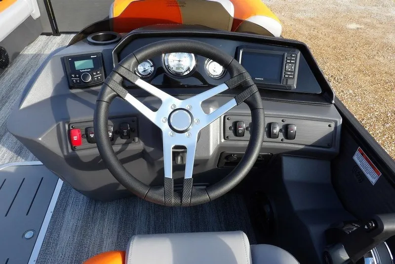 Slide: The Image of 2026 Bennington 22 SSR boat dashboard with steering wheel and control panel. - 26