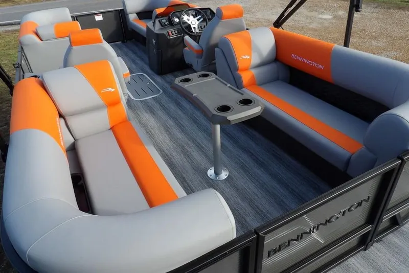 Slide: The Image of 2026 Bennington 22 SSR pontoon boat interior with orange and gray seating, modern design. - 31