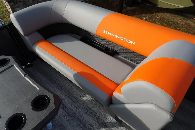Slide: The Image of 2026 Bennington 22 SSR boat interior with orange and gray seating. - 32