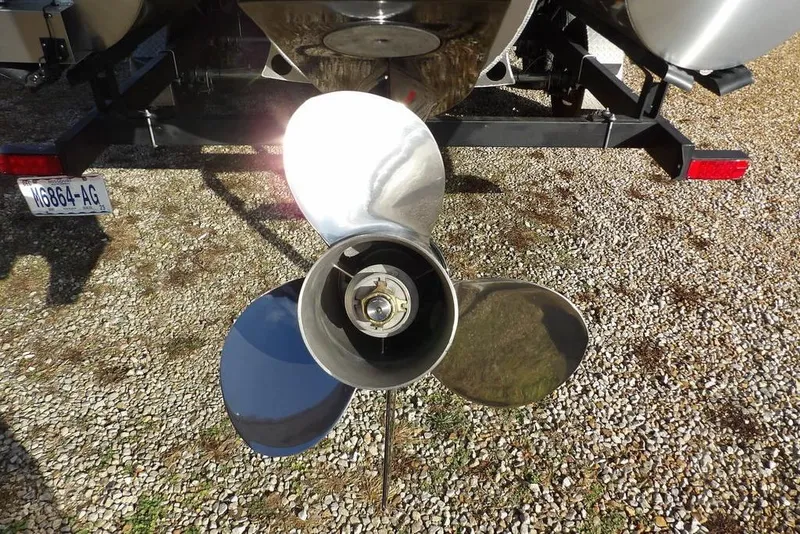 Slide: The Image of Propeller of 2026 Bennington 22 SSR boat on gravel surface. - 34