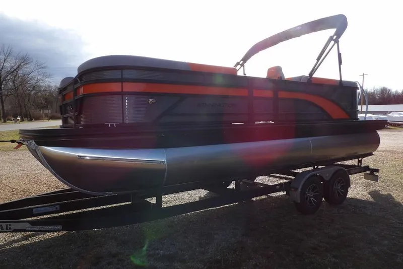 Slide: The Image of 2026 Bennington 22 SSR pontoon boat on trailer, featuring sleek design and vibrant accents. - 5