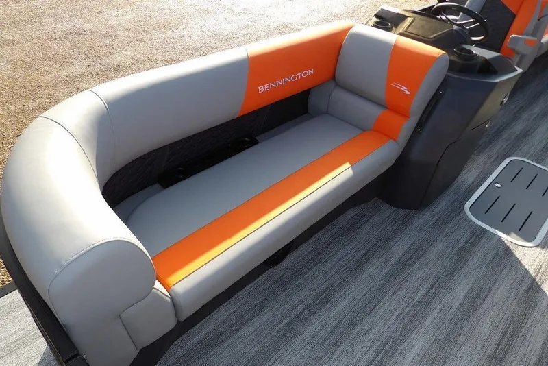 Slide: The Image of 2026 Bennington 22 SSR boat interior with gray and orange seating. - 9