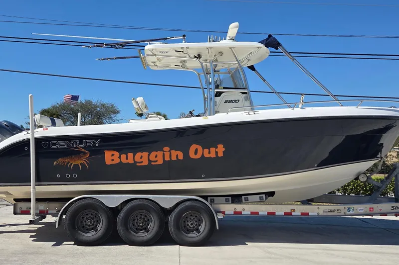 The Image of 2006 Century 2900 Center Console boat named "Buggin Out" on a trailer. - 0