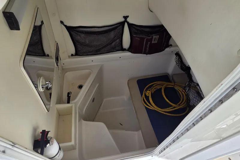 Slide: The Image of Interior of a 2006 Century 2900 Center Console boat with storage and equipment. - 13