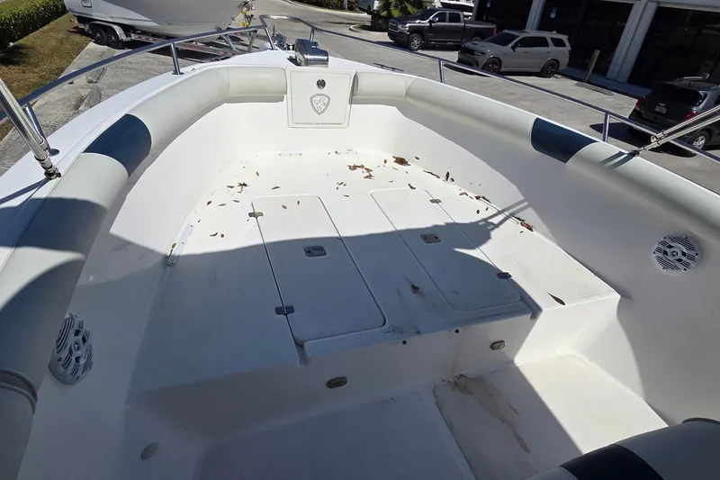 Slide: The Image of 2006 Century 2900 Center Console boat interior with leaves scattered on deck. - 17