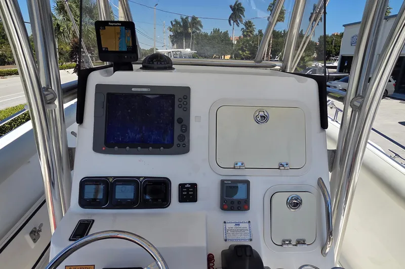 Slide: The Image of Center console of a 2006 Century 2900 boat with navigation equipment. - 19