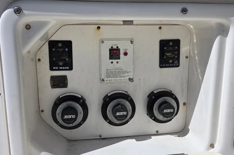 Slide: The Image of Control panel of a 2006 Century 2900 Center Console boat with switches and dials. - 23