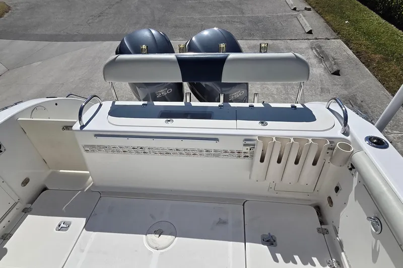 Slide: The Image of 2006 Century 2900 Center Console boat with Yamaha 250 engines, featuring rod holders and seating. - 25