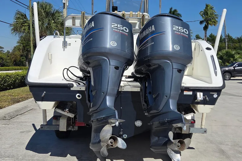 Slide: The Image of 2006 Century 2900 Center Console with dual Yamaha 250 outboard engines, parked outdoors. - 3