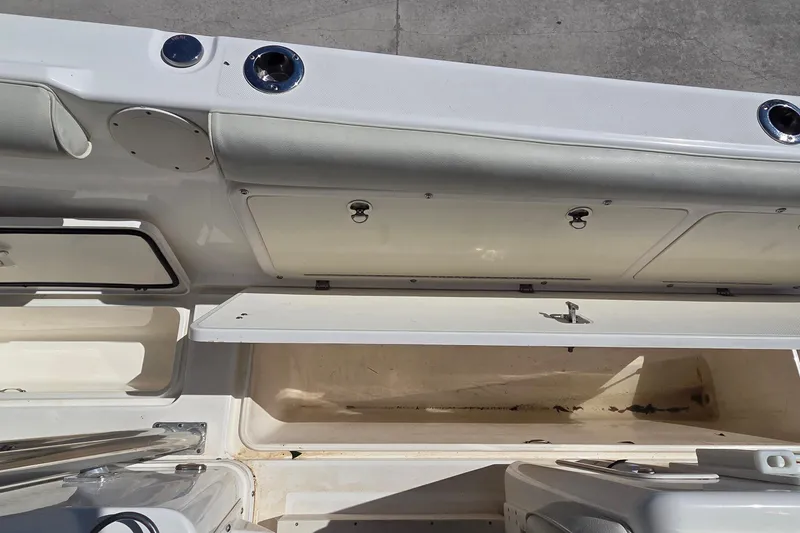 Slide: The Image of 2006 Century 2900 Center Console boat storage compartments open, showcasing interior space. - 5