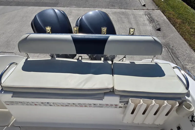 Slide: The Image of 2006 Century 2900 Center Console boat with cushioned seating and dual outboard motors. - 6