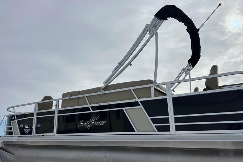 Slide: The Image of 2019 SunChaser Geneva Fish 20 Cnf pontoon boat with canopy, side view. - 10
