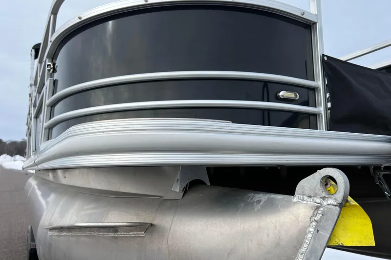 Slide: The Image of 2019 SunChaser Geneva Fish 20 Cnf pontoon boat, close-up of sleek aluminum exterior. - 13