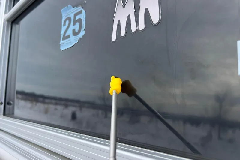 Slide: The Image of Yellow tool on SunChaser Geneva Fish 20 Cnf window, 2019 model, with number 25 sticker. - 15