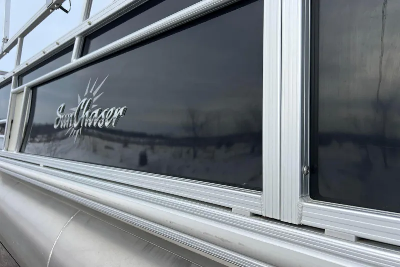 Slide: The Image of 2019 SunChaser Geneva Fish 20 Cnf pontoon boat with sleek aluminum siding. - 16