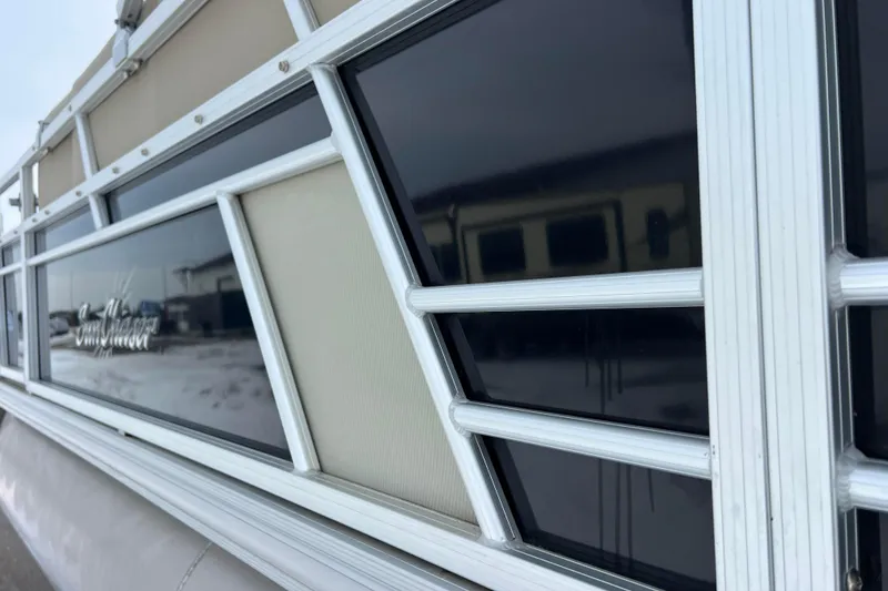 Slide: The Image of Close-up of 2019 SunChaser Geneva Fish 20 Cnf pontoon boat exterior detailing. - 20