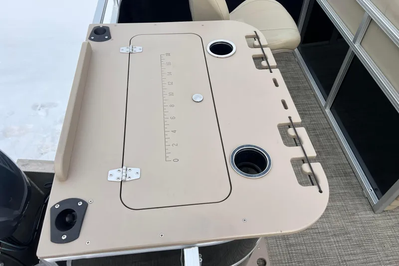 Slide: The Image of Fishing station on 2019 SunChaser Geneva Fish 20 Cnf pontoon boat with built-in ruler and cup holders. - 26