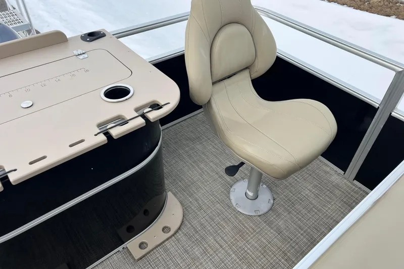 Slide: The Image of 2019 SunChaser Geneva Fish 20 Cnf boat interior with beige captain's chair and fishing station. - 27