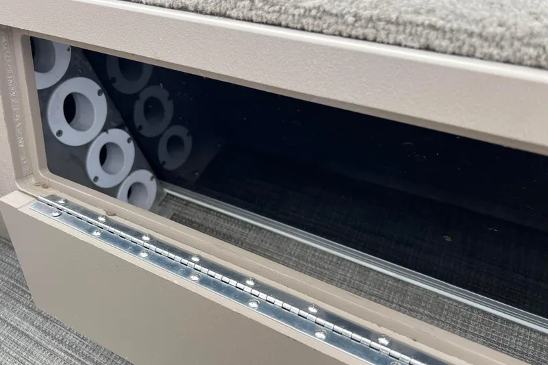 Slide: The Image of Storage compartment in 2019 SunChaser Geneva Fish 20 Cnf boat, featuring rod holders. - 29