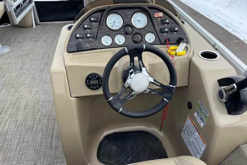 Slide: The Image of 2019 SunChaser Geneva Fish 20 Cnf boat dashboard with steering wheel and gauges. - 30