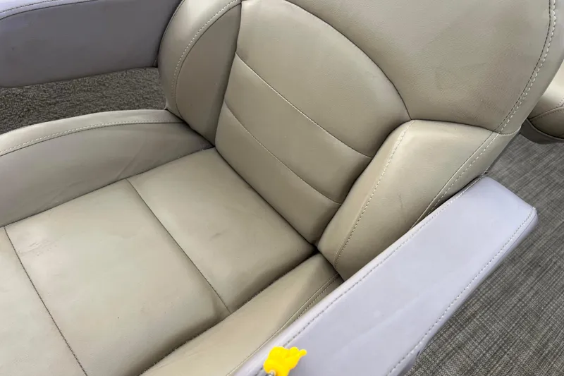Slide: The Image of Beige leather seat of 2019 SunChaser Geneva Fish 20 Cnf boat, with armrest detail. - 33