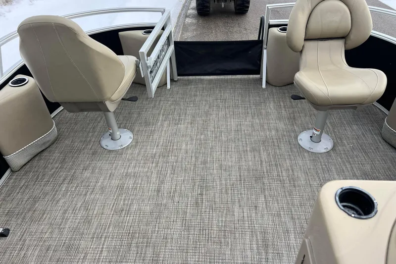 Slide: The Image of 2019 SunChaser Geneva Fish 20 Cnf boat interior with beige seating and carpeted floor. - 41