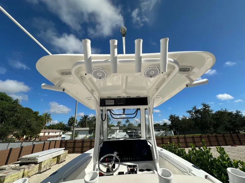 Slide: The Image of Sea Hunt Gamefish 27 boat, 2021, under blue sky. - 14