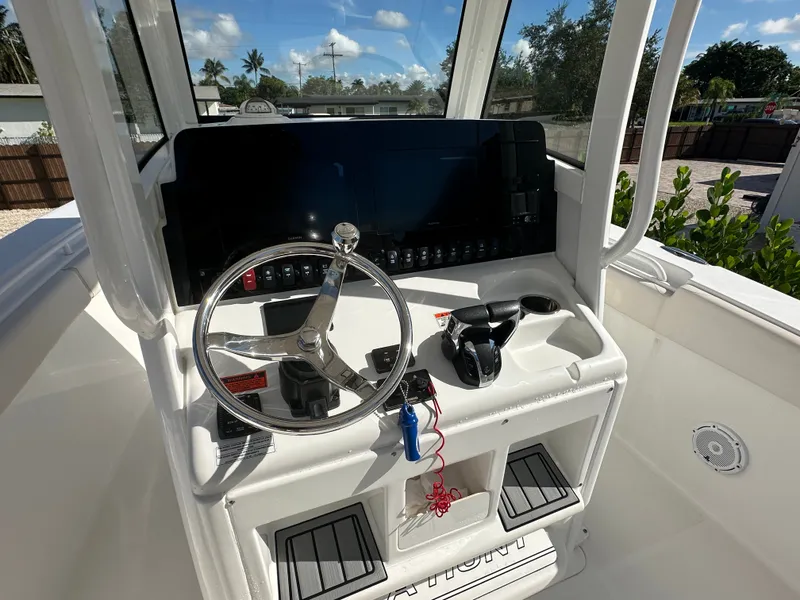Slide: The Image of Helm console of a 2021 Sea Hunt Gamefish 27 boat. - 15