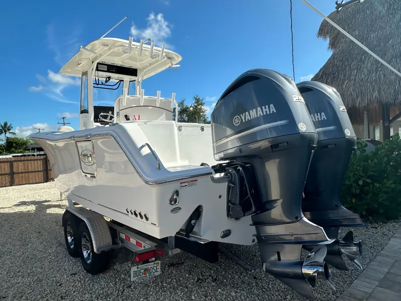 Slide: The Image of 2021 Sea Hunt Gamefish 27 with Yamaha engines, on trailer. - 3