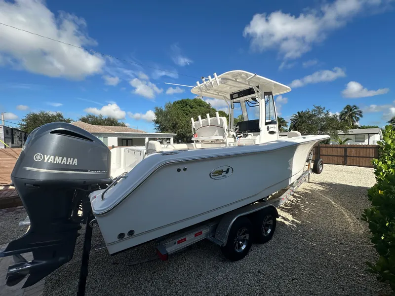Slide: The Image of 2021 Sea Hunt Gamefish 27 boat with Yamaha engine, on trailer. - 6