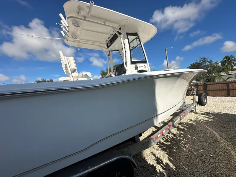 Slide: The Image of 2021 Sea Hunt Gamefish 27 on trailer under blue sky. - 7