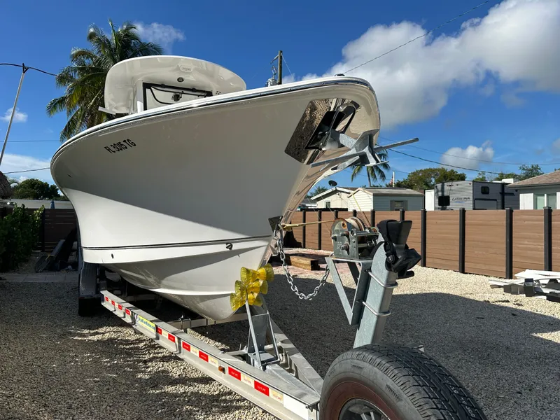 Slide: The Image of Sea Hunt Gamefish 27 boat on trailer, 2021 model, sunny day. - 9