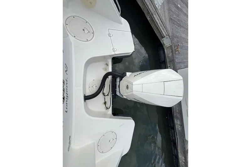 Slide: The Image of Boston Whaler 240 Vantage 2022 boat with outboard motor at dock. - 25