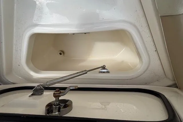 Slide: The Image of Storage compartment of a 2022 Boston Whaler 240 Vantage boat, open and empty. - 27