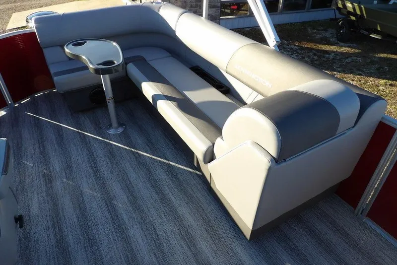 Slide: The Image of 2026 Bennington 21 S L-Bench pontoon boat interior with gray seating and table. - 13