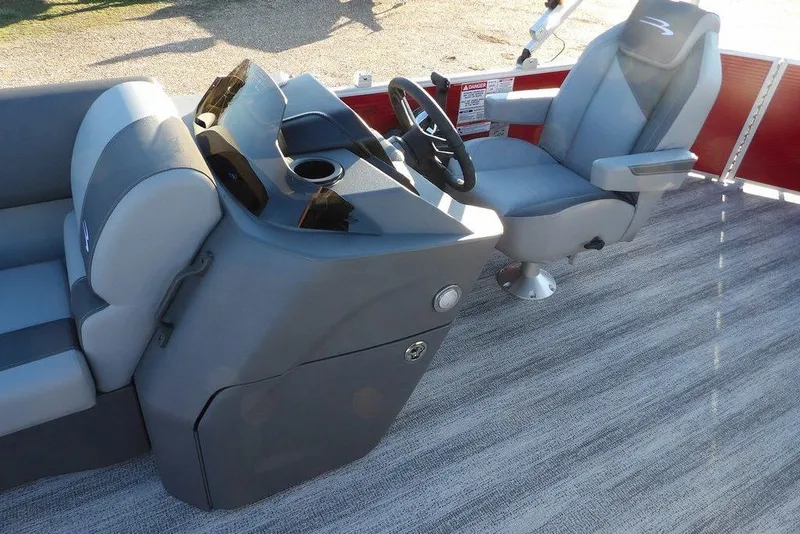 Slide: The Image of 2026 Bennington 21 S L-Bench boat interior with steering console and seating. - 16